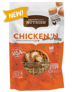 Rachael Ray® Nutrish® Chicken 'N Waffle Bites dog treats in a white and orange bag with an image of three pieces of raw chicken and a clear section showing the golden-brown dog treats within
